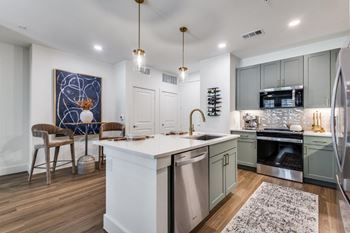 Gourmet prep island with pendant lighting*